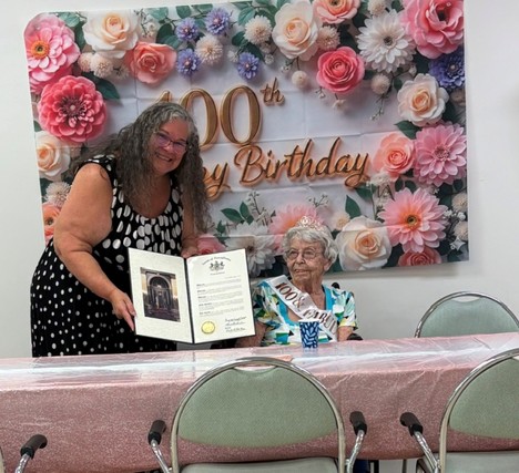 Rosemary Middleton holds a Pennsylvania Senate citation while celebrating her 100th birthday.